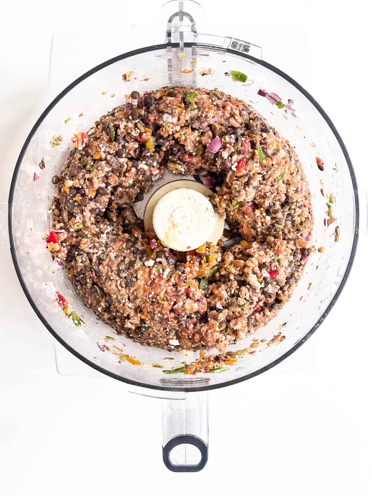 Making veggie smash burger mixture in food processor.