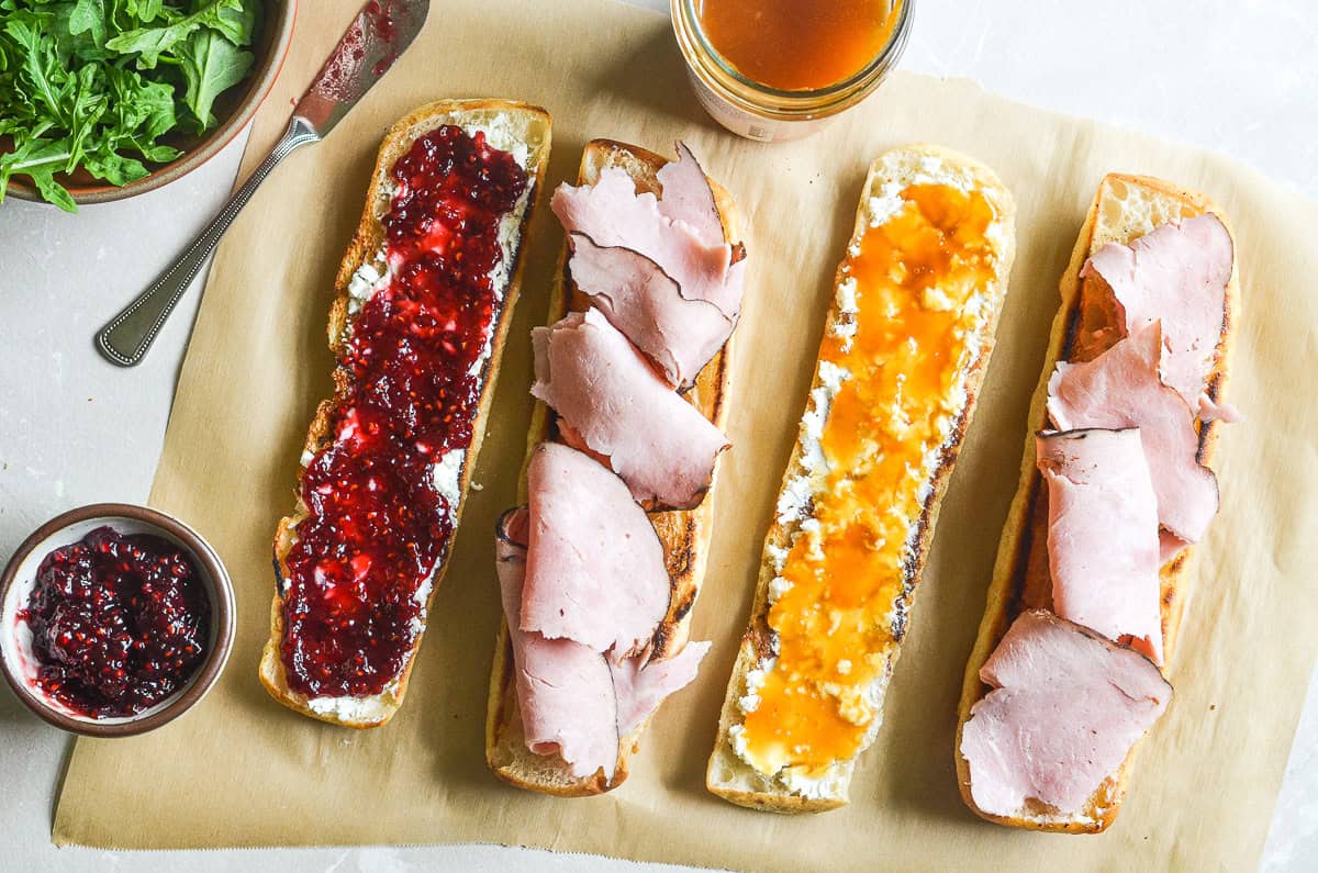 making a ham and jam sandwich.