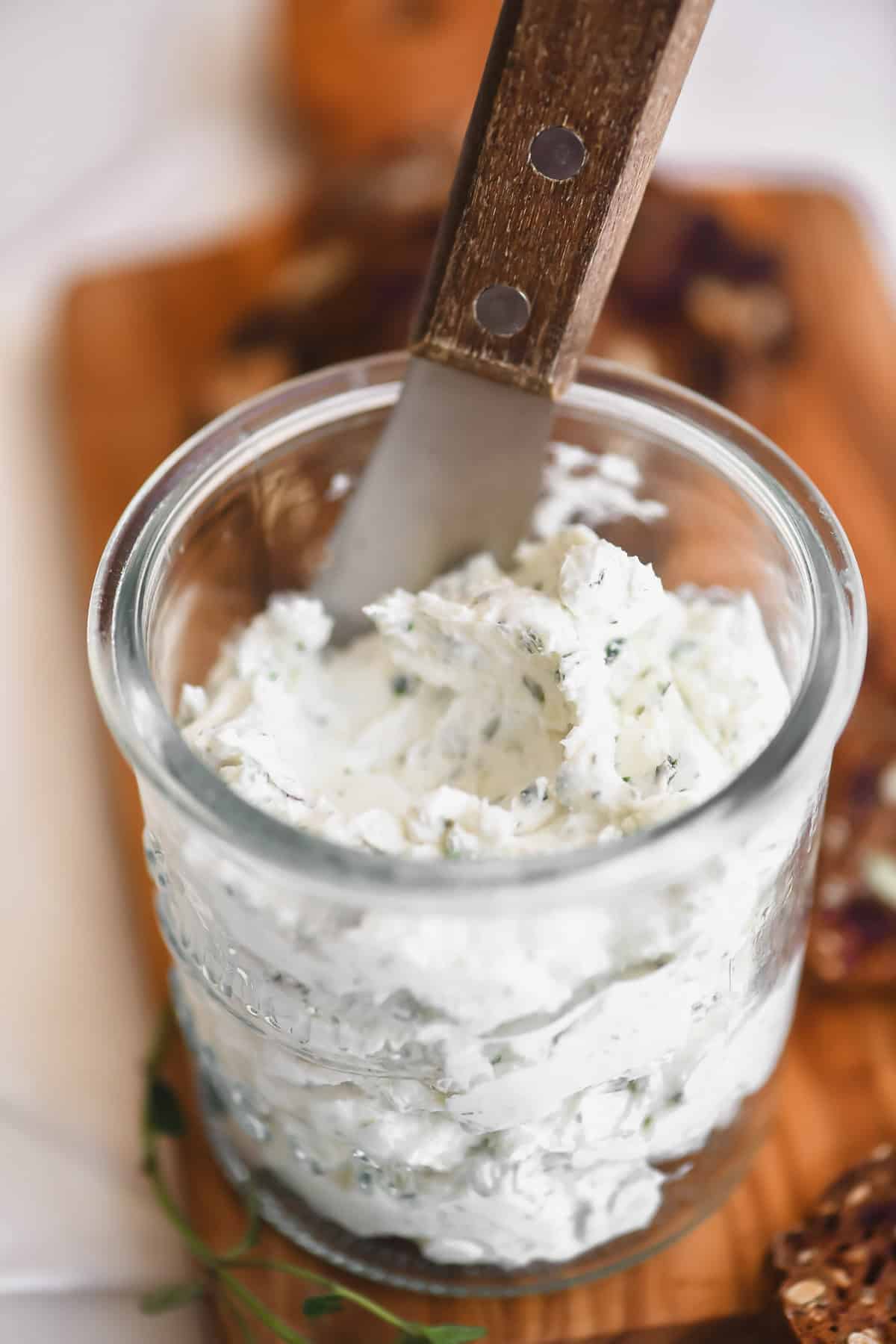 a small glass jar of homemade Boursin cheese.