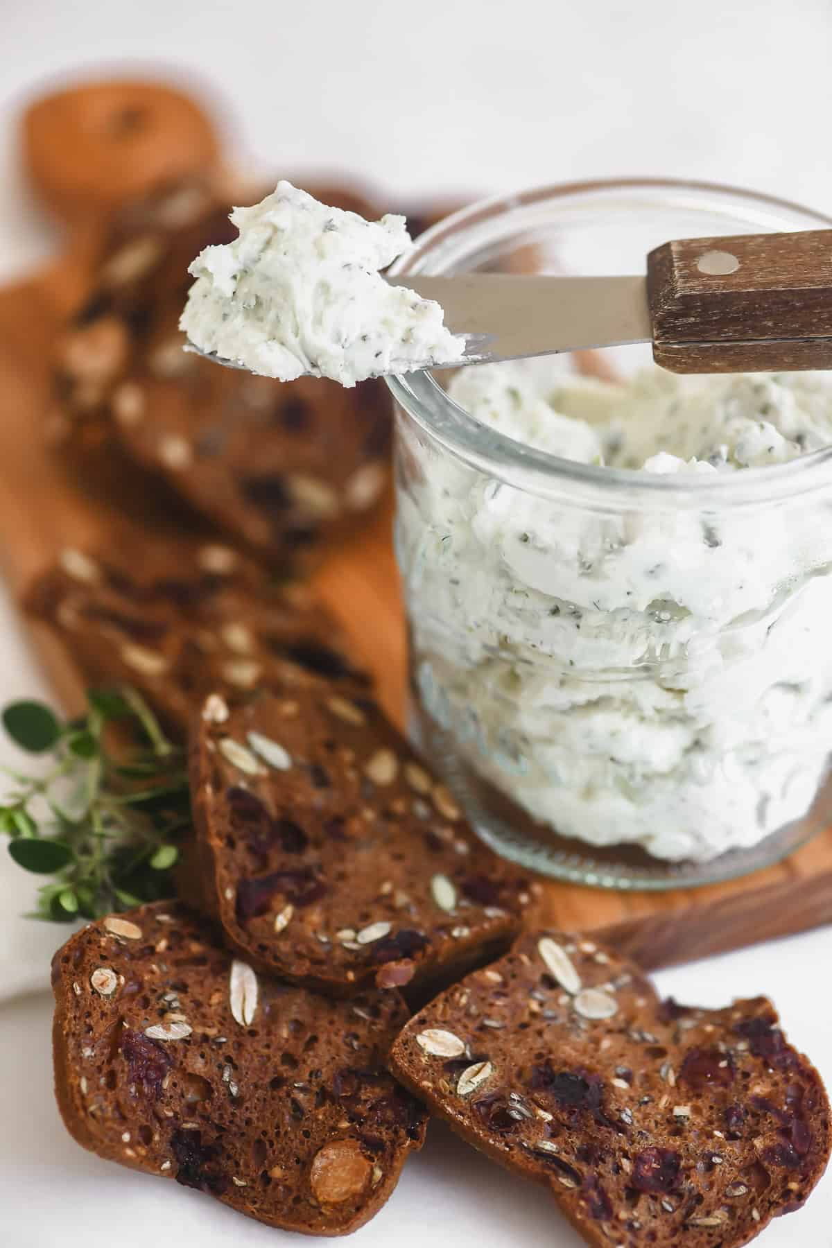 A jar of homemade Boursin with crackers.
