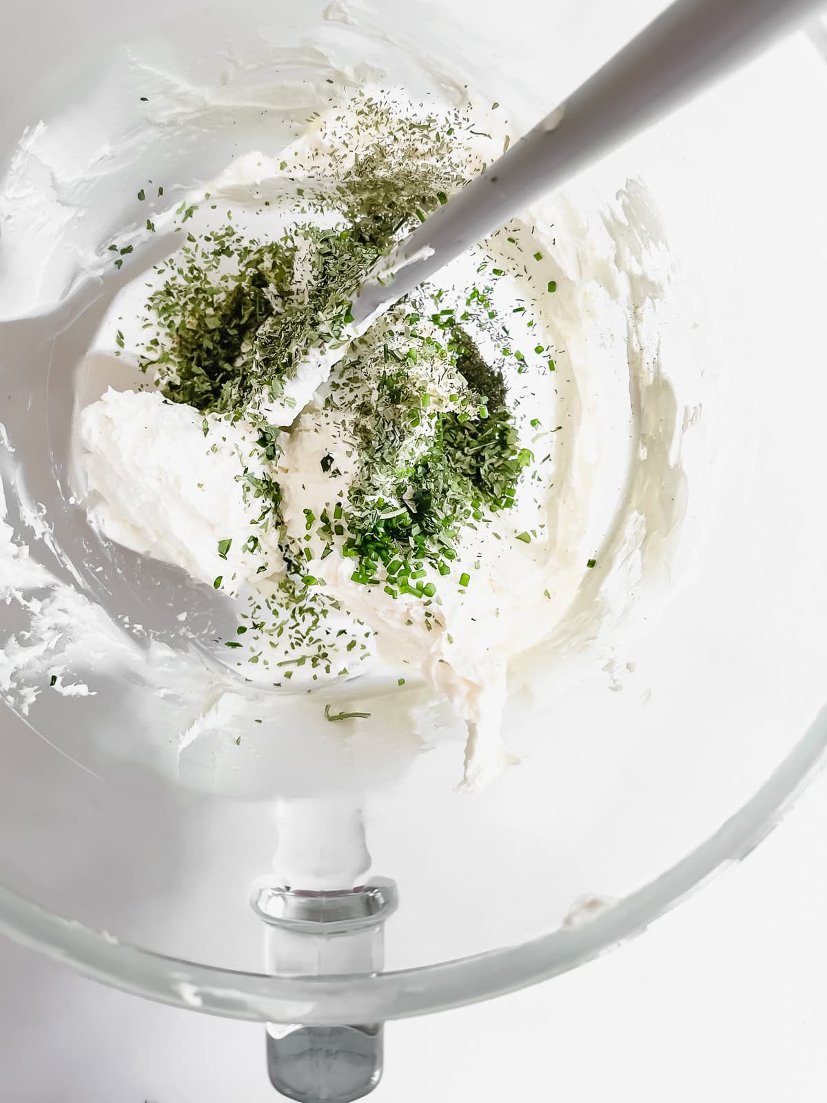 making homemade Boursin cheese in a stand mixer bowl.