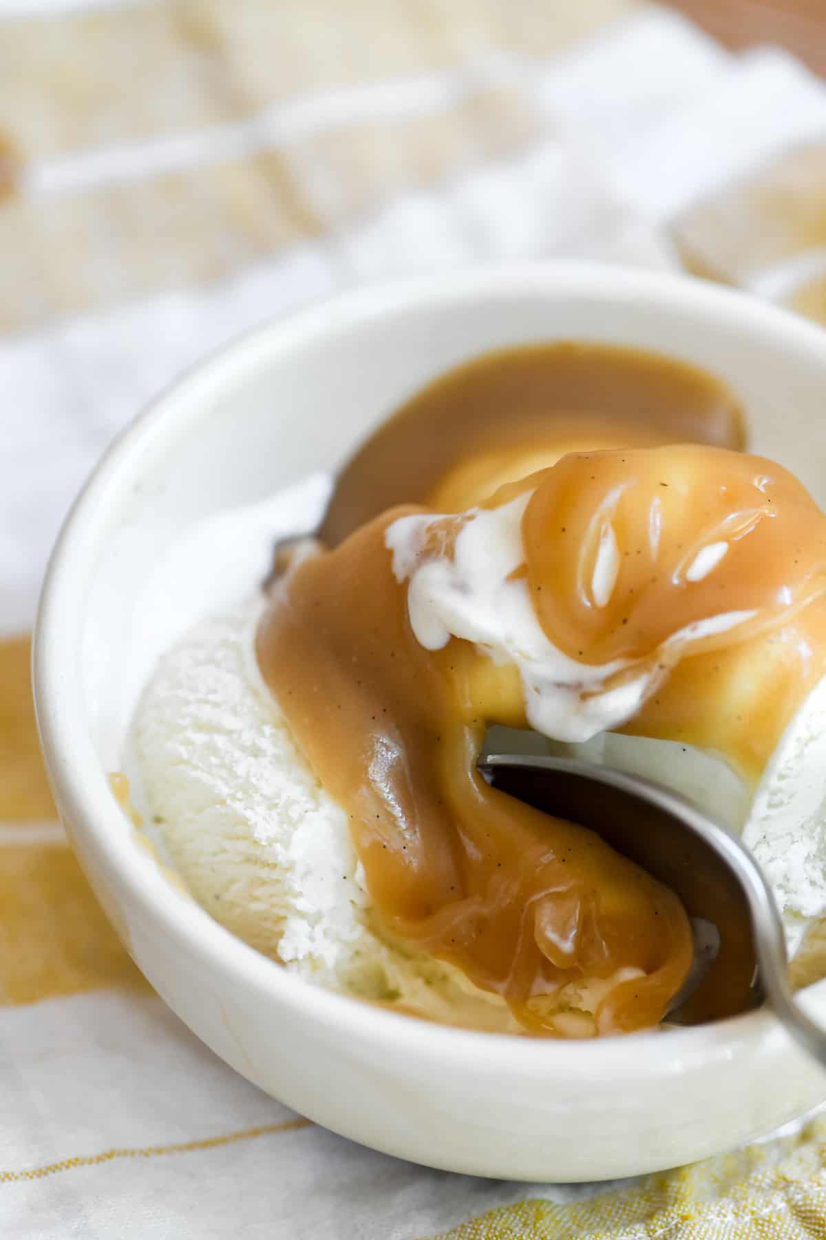 homemade butterscotch sauce on ice cream.