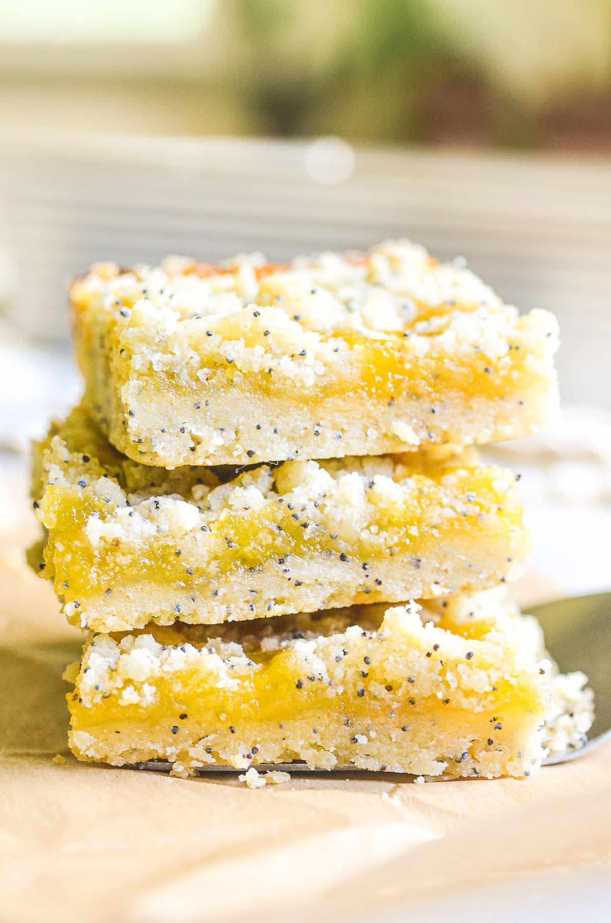 a stack of lemon poppy seed crumble bars.