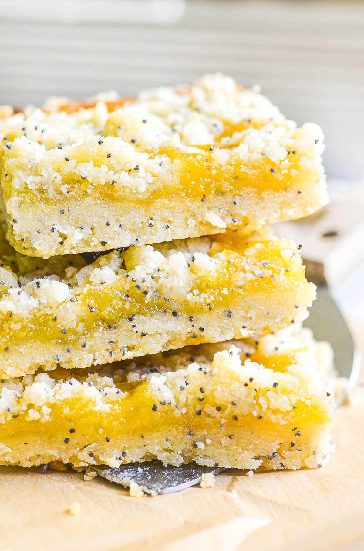 lemon poppy seed bars, sliced and stacked.