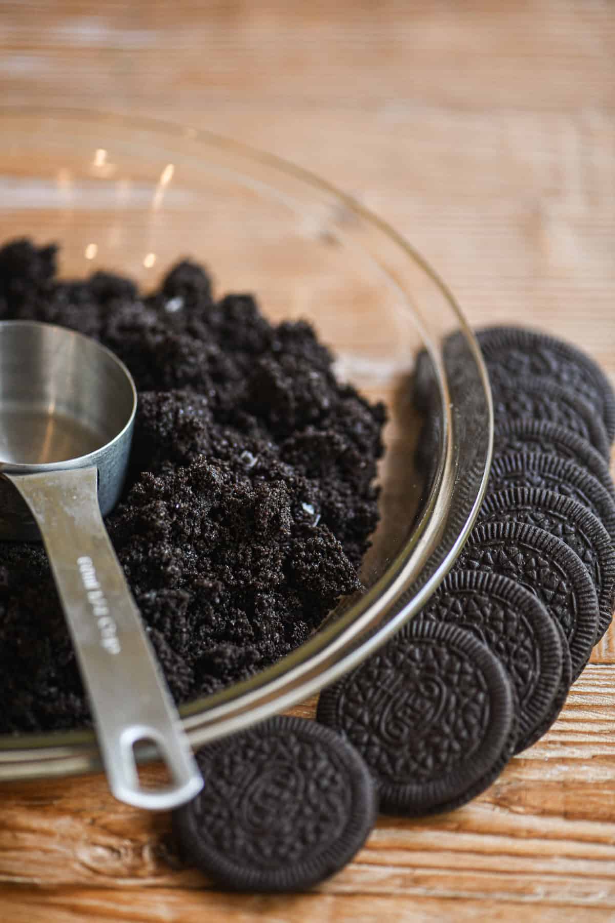 Making a crushed oreo crust for a frozen mudslide pie.