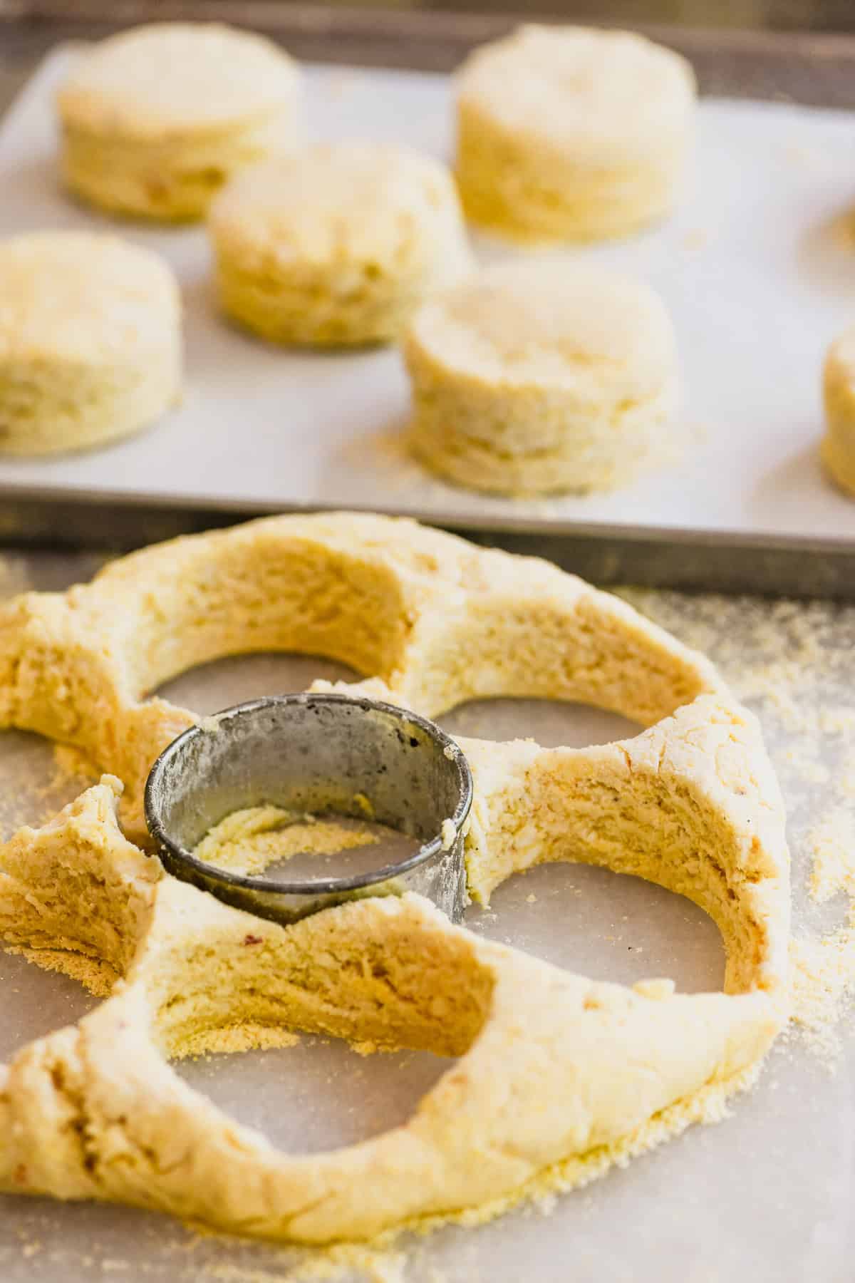 Cutting out hot honey corn biscuits.