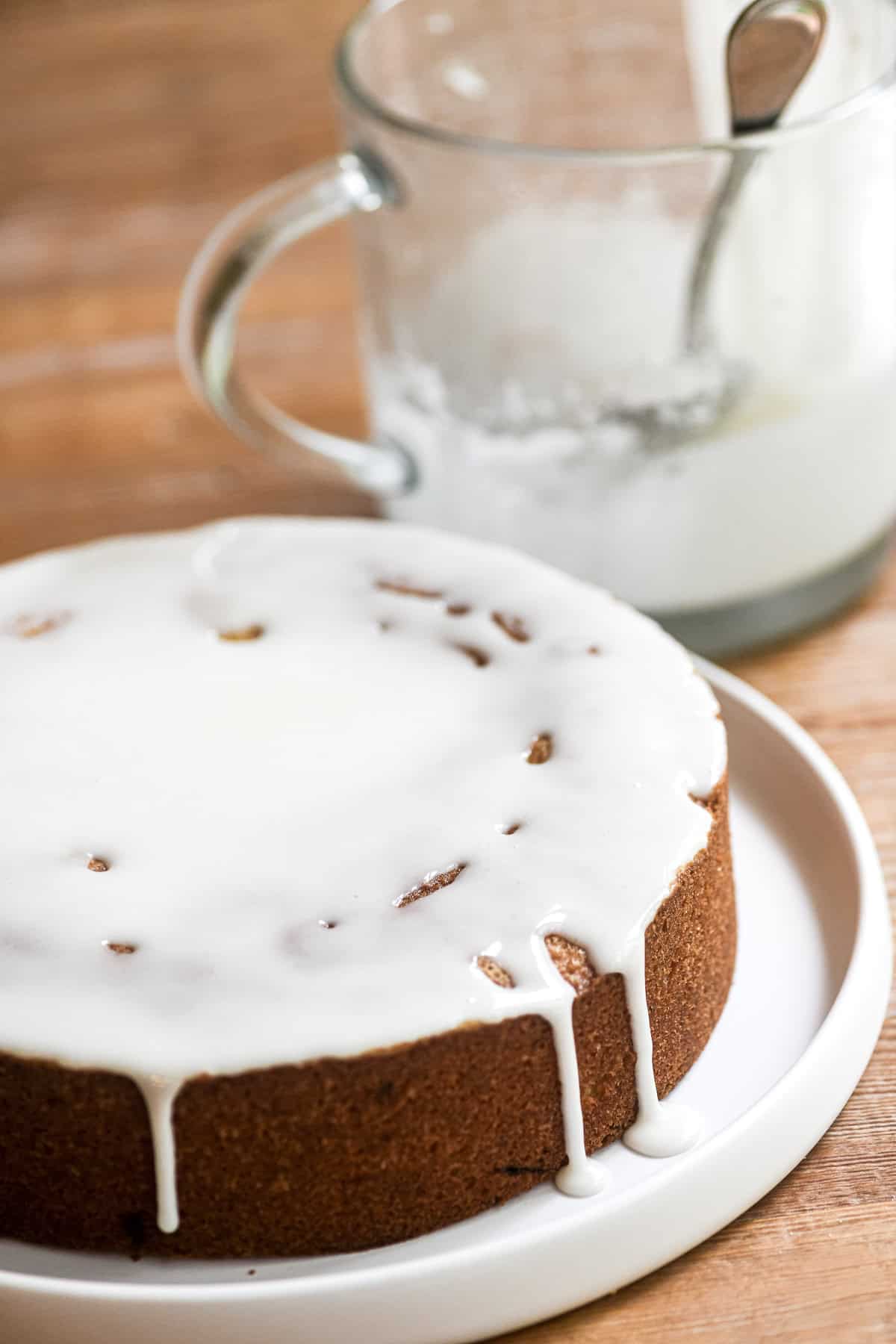 Glazing a lemon pistachio snack cake.