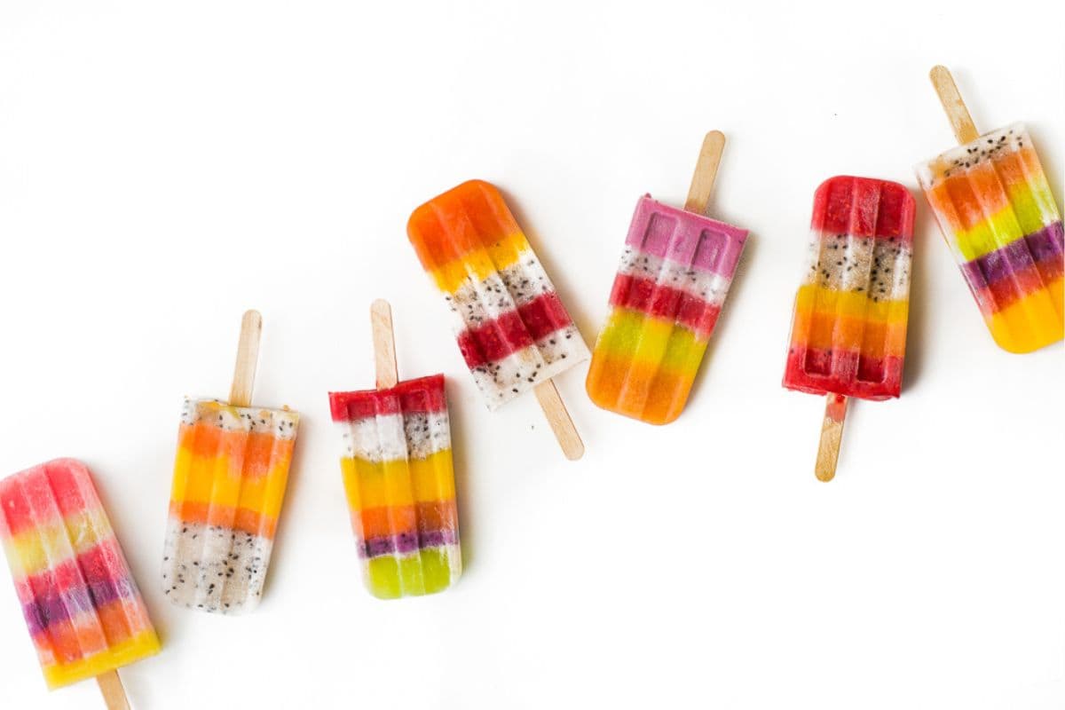 colorful striped popsicles are indibidual frozen desserts for summer.