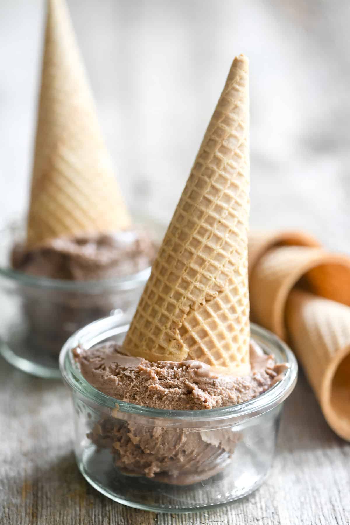 A no-churn Nutella ice cream cone, upside down in a Weck glass jar.