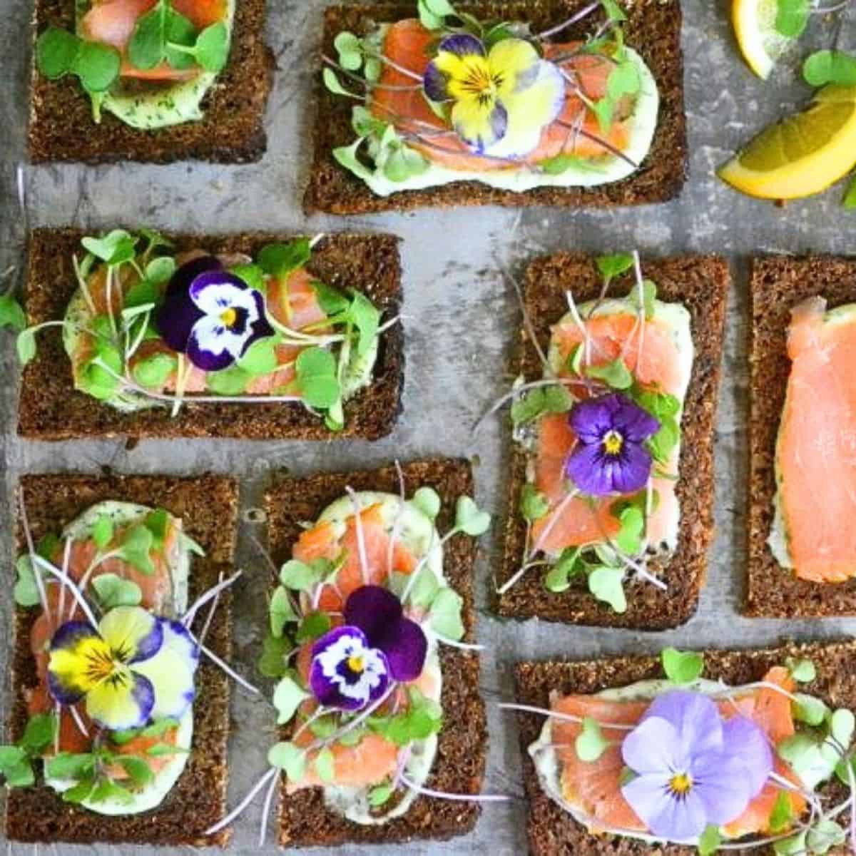 Nordic open faced smoked salmon sandwiches on toasted rye bread.