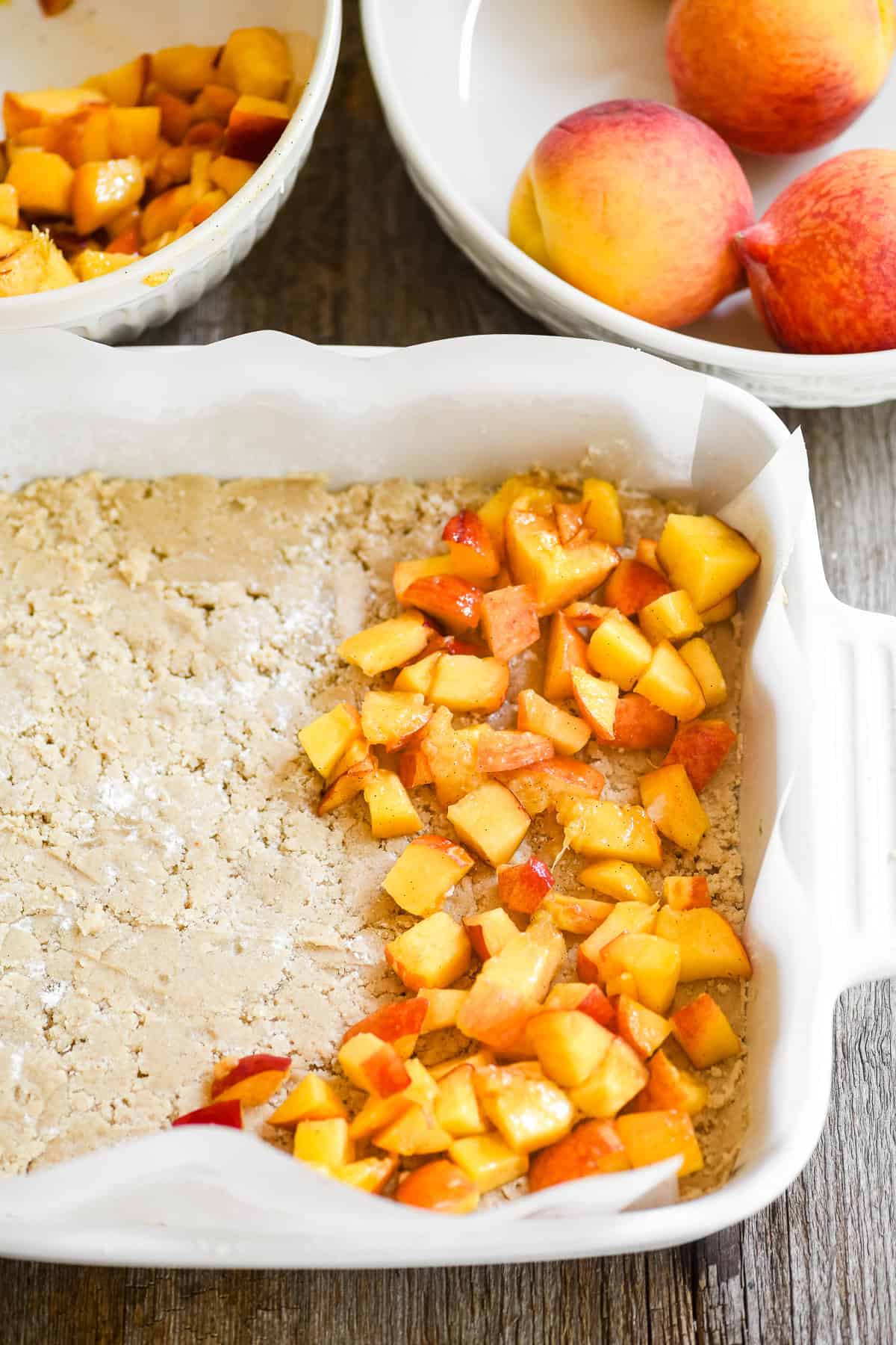 Chopped peaches on spiced peach cobbler crust.