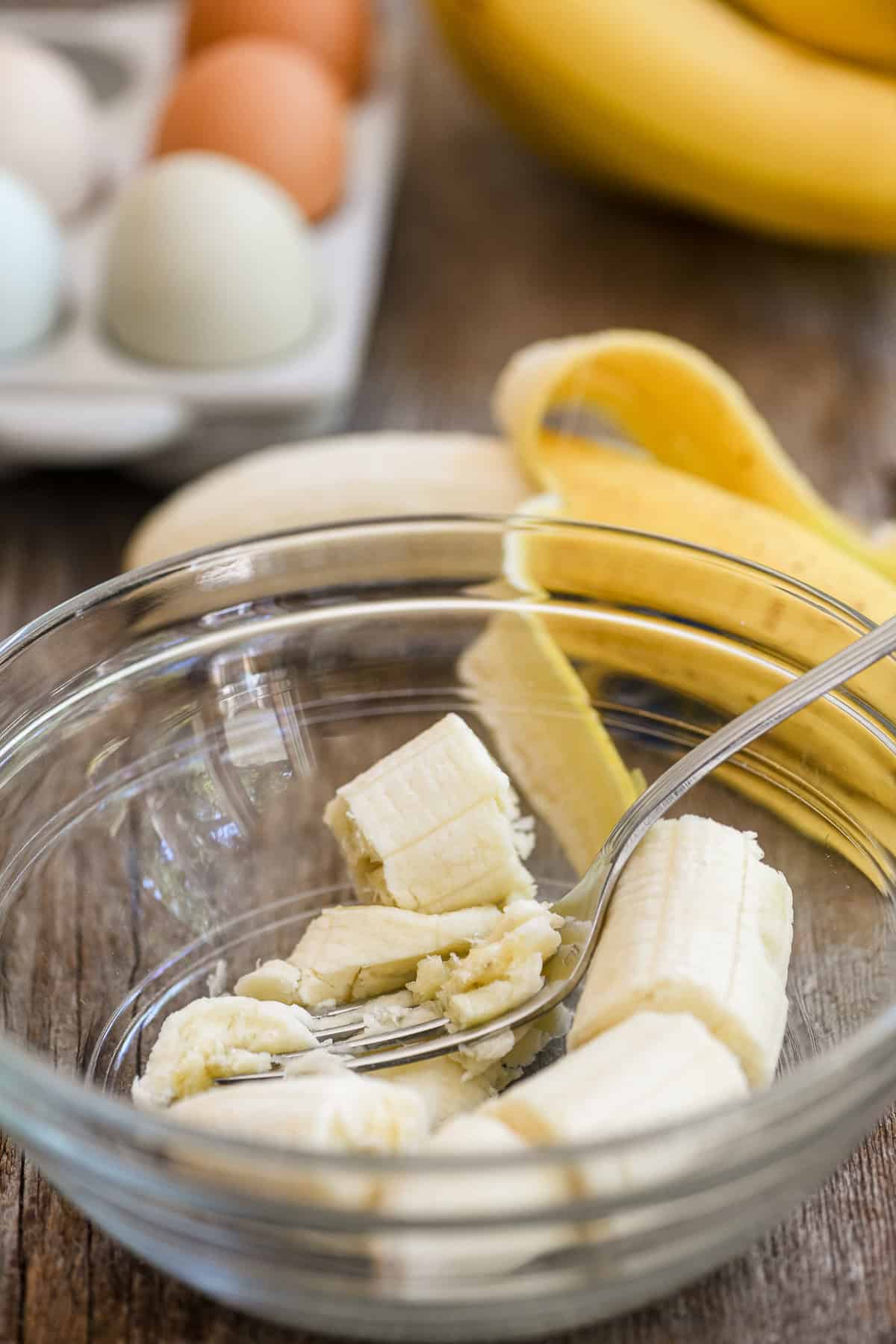 mashing bananas for banana cake.