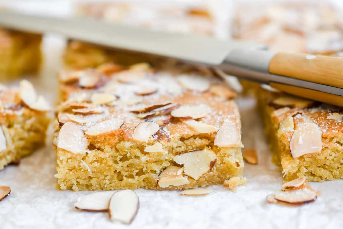 Soft almond brownies, with knife.
