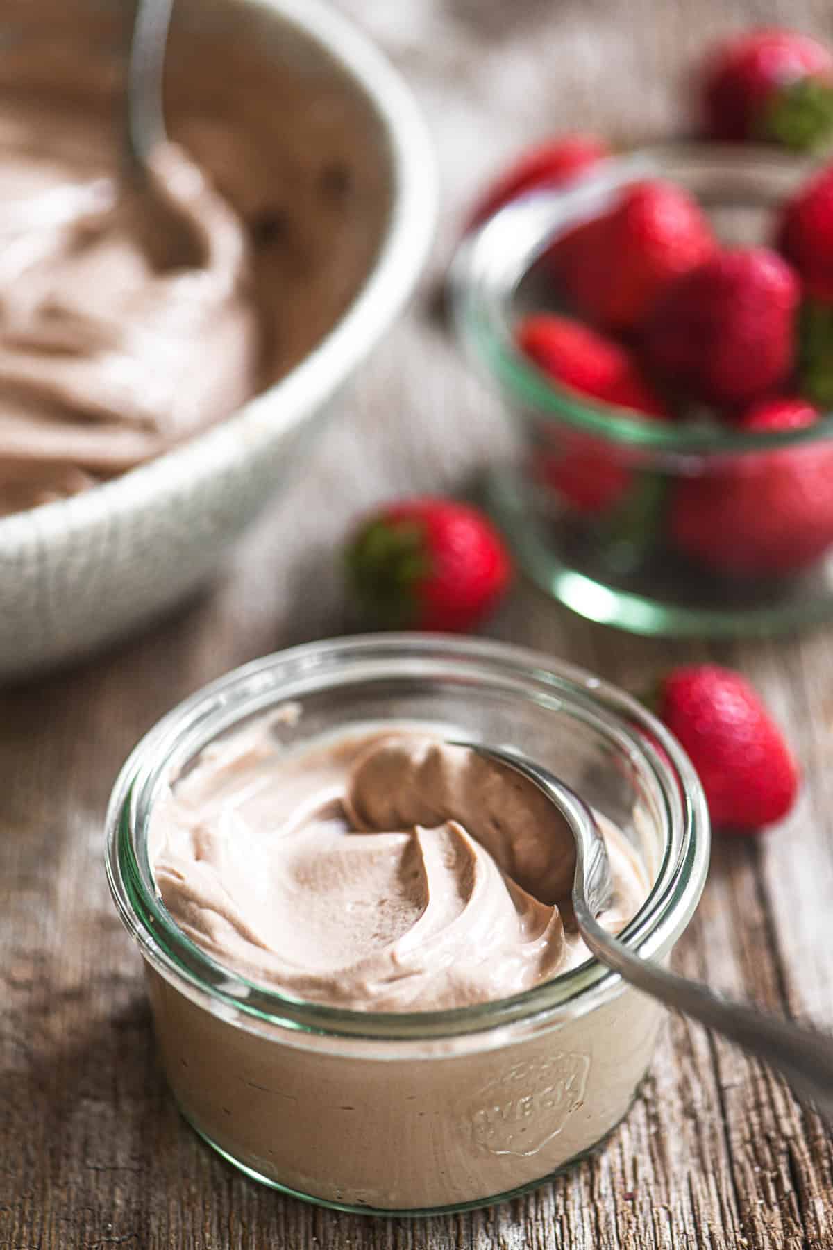 chocolate hazelnut yogurt in a small bowl with strawberries.