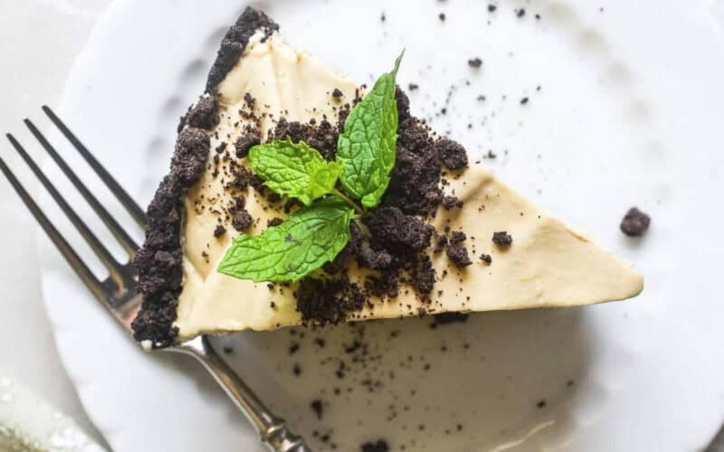 A slice of Mint Cold Brew Ice Cream Pie on a plate with fork.