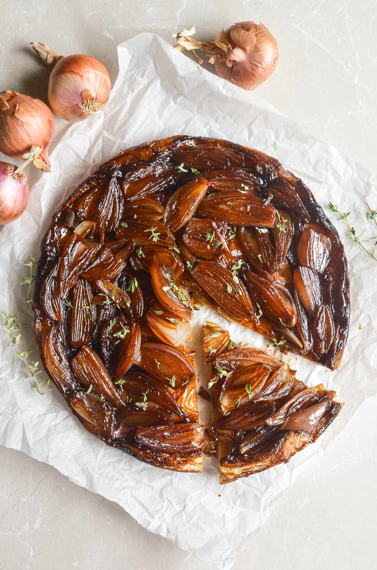 shallot tarte tatin with slice taken out.