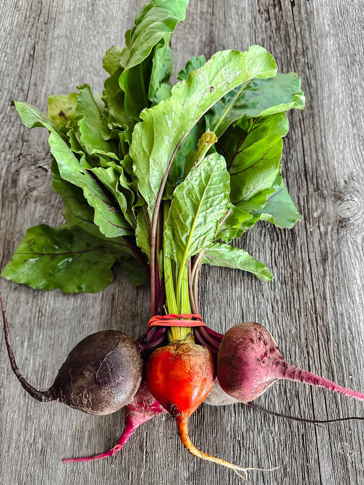 baby beets on a wooden table.