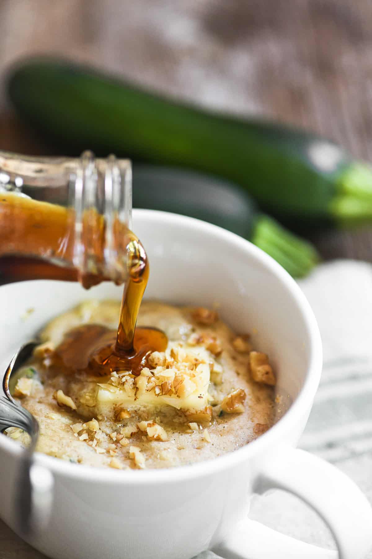 Microwaved zucchini bread pancake in a mug.