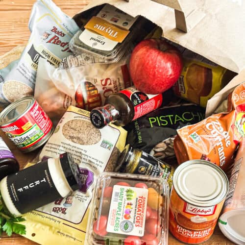 A bag of groceries spilled out on the table.