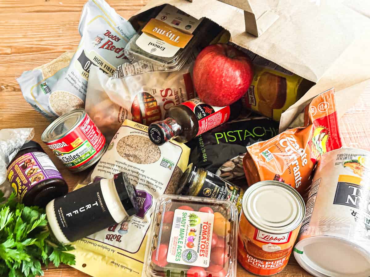 A bag of groceries spilled out on the table.