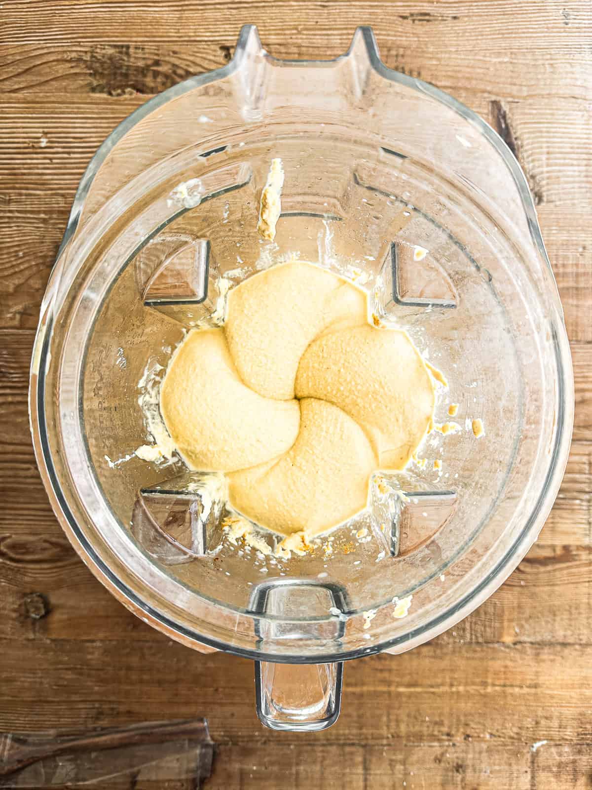 Blending Moroccan hummus in a vitamix blender.