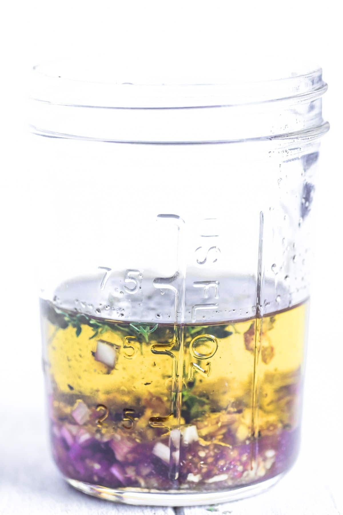 a homemade vinaigrette salad dressing in a jar.