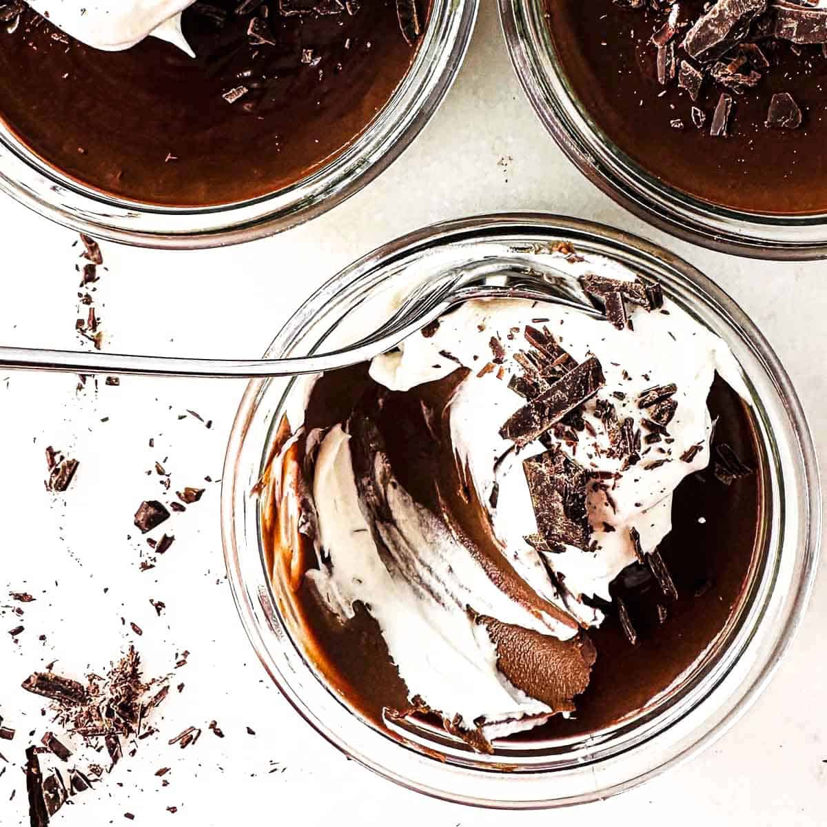 The bite shot of a little jar of chocolate pot de creme.