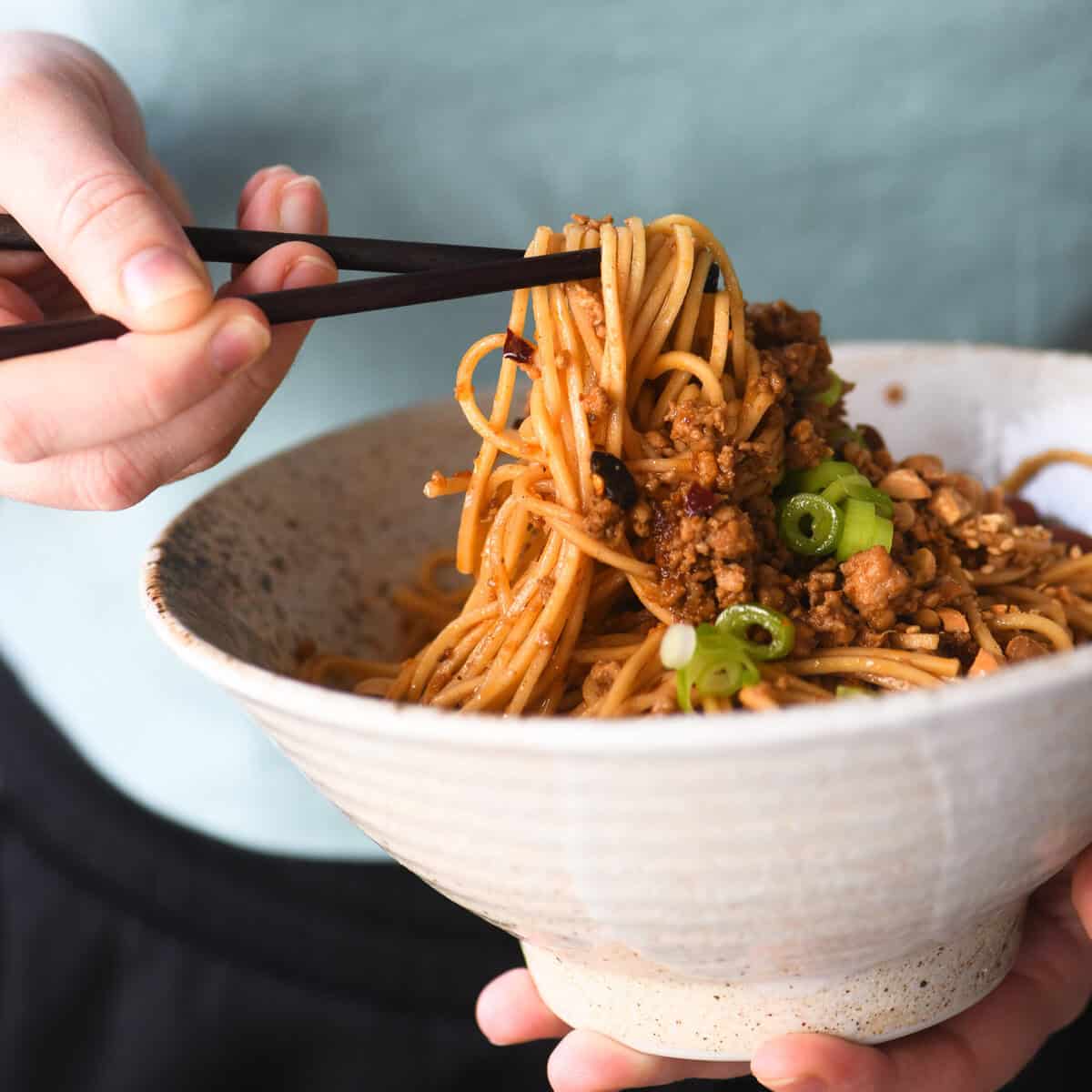 Chinese Burning Noodles in a bowl with chopsticks.